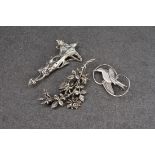 A collection of art nouveau silver brooches, comprising one in the form of a swallow, and two of