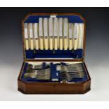 An oak cased canteen of silver plated cutlery, six settings, by Walker & Hall, some elements
