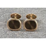 Patek Philippe - a pair of 18ct yellow gold Ellipse cuff-links, the central polished bronze coloured