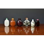 A collection of Chinese glass snuff bottles, 20th century, to include a carved Peking cameo snuff