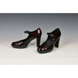 A pair of Tods ladies wine red patent leather shoes, with high heel, single high strap fastening, UK