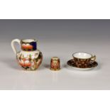 A collection of Royal Crown Derby miniatures, in the Imari palette, comprising a cup and saucer, the