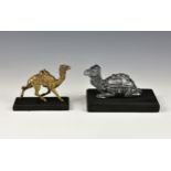 A gilt bronze camel figurine, the camel wearing Arabian style saddle in running pose, raised on