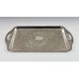 An Indian silver tray, probably early 20th century, of rectangular form with integral twin