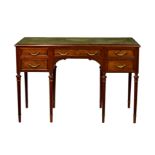 An English Louis XVI style mahogany and parcel gilt dressing table, c.1910, the moulded top with