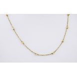 An 18ct yellow gold chain, featuring small gold balls interspersed between 23mm sections of thin,