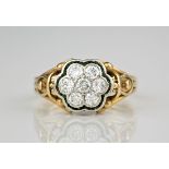 A mid-century 14ct yellow gold, platinum, emerald and diamond cluster ring, the central floral