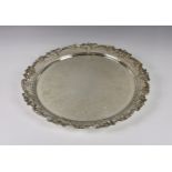 A silver plated salver / serving tray, of circular shaped form with cast grapevine and pierced