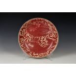 William De Morgan (1839-1917) - a ruby lustre shallow dish or charger, 1890s, believed to be by