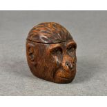 A late Victorian / early Edwardian novelty treen inkwell fashion as a monkey / gorilla head,