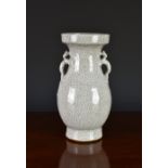 A Chinese crackle glazed stoneware vase, 19th / 20th century, of baluster form with cupped rim, twin