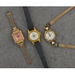Two mid-century 9ct gold ladies manual wind wrist watches, comprising a J. W. Benson of London