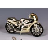 An Italian sterling silver model of a racing motorbike, marked with star - 175 - AR (Arezzo) &