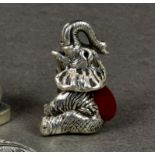 A modern novelty silver pin cushion fashioned as an elephant, stamped sterling, having red velvet