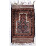 A Taimani prayer rug, the bottle shaped field with geometric decoration, within multiple geometric