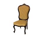 A Victorian carved walnut balloon back side chair, the moulded showframe with buttoned back with