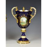 A limited edition Coalport Fine Bone China Royal commemorative triple-handled campana vase, or