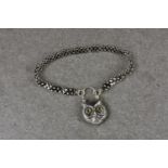 A novelty silver double linked bracelet with owl padlock, the bracelet interspersed with flower
