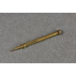 An 18ct gold Sampson Mordan retractable pencil, not marked but tests as 18ct, engine turned