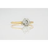 An 18ct yellow gold and diamond single stone ring, the brilliant cut diamond measuring approximately