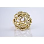 An 18ct yellow gold and diamond floral bombe ring, with loops of yellow gold forming ornate pavé