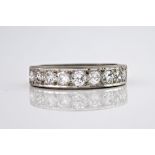 An 18ct white gold half eternity ring, the graduated brilliant cut diamonds weighing a total of