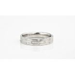 An 18ct white gold and diamond studded band, with three rows of evenly dispersed, alternating