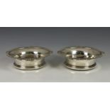 A pair of George V silver wine coasters, Goldsmiths & Silversmiths Co. Ltd., London 1913, of