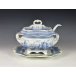A 19th century English blue & white pottery transferware soup tureen and cover, with stand and
