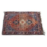 A large Bulwadi / Qashqai rug, the madder field decorated with boteh, floral and animal motifs,