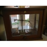 Post Office scale in Glass Cabinet, reasonable condition with weights. COLLECTION ONLY, NO POST