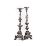 TWO SILVERED METAL ALTAR CANDLESTICKS, PROBABLY ITALIAN, MID 18TH CENTURY