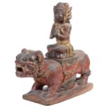 A CARVED AND PAINTED WOOD FIGURE OF A MYTHICAL LION, POSSIBLY BARONG, BALI, INDONESIA, 19TH CENTURY