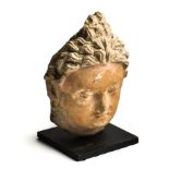 A GANDHARA STUCCO HEAD OF BUDDHA, NORTH-WEST FRONTIER REGION, INDIA (NOW PAKISTAN), 4TH / 5TH CENTUR