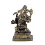 A BRASS FIGURE OF GANESHA, WESTERN DECCAN, INDIA, CIRCA 18TH CENTURY