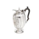 AN EDWARDIAN SILVER HOT WATER JUG, WALKER & HALL LTD., SHEFFIELD, 1902