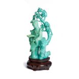 A CHINESE CARVED TURQUOISE FIGURE OF A MAIDEN, 20TH CENTURY