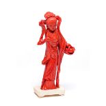 ˜A CHINESE CARVED CORAL FIGURE OF A MAIDEN, EARLY 20TH CENTURY