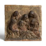 AN ITALIAN TERRACOTTA RELIEF PANEL OF 'LO SPASIMO' (THE SWOON OF THE VIRGIN), PROBABLY AFTER GIOVANN