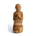 A SANDSTONE FIGURE OF A BUDDHIST DEVOTEE, BURMA, CIRCA 15TH CENTURY