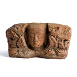 A JAVANESE TERRACOTTA ANTEFIX, INDONESIA, CIRCA 10TH CENTURY