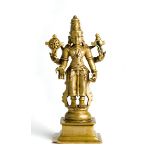 A BRASS FIGURE OF VISHNU, DECCAN, SOUTHERN INDIA, CIRCA 18TH CENTURY