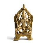 A BRASS FIGURE OF BHADRAKALI, GUJARAT, WESTERN INDIA, CIRCA 16TH CENTURY