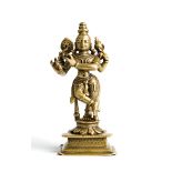 A BRASS FIGURE OF KRISHNA VENUGOPALA, WESTERN DECCAN, INDIA, 18TH CENTURY