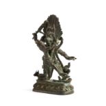 A SINO-TIBETAN BRONZE FIGURE OF YAMA IN YAB-YUM, 19TH CENTURY