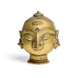 A BRASS GAURI HEAD, WESTERN INDIA, 19TH CENTURY