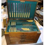 An EPNS part canteen of cutlery with bone handled knives in oak 3 drawer box with rising lid