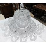 A Bohemian cut crystal covered punch bowl, with matching circular trays ad 12 cups