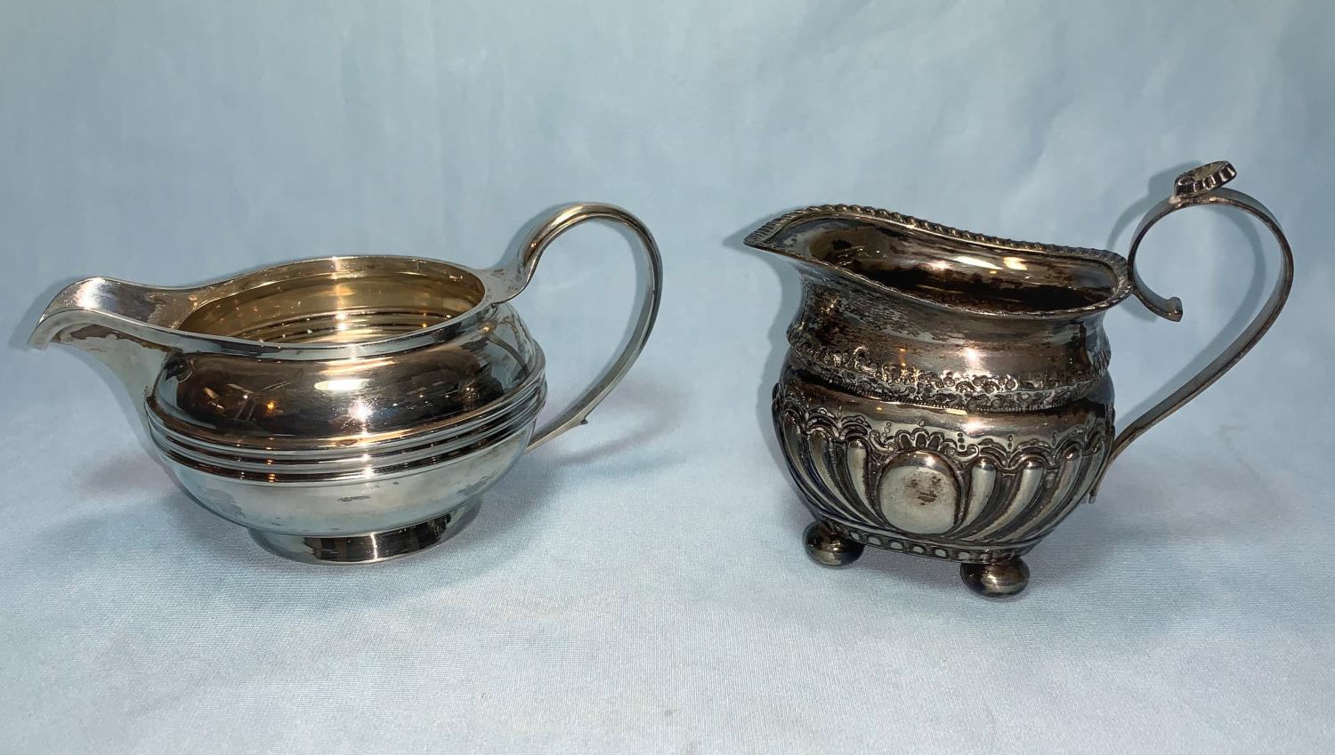 A silver cream jug, Sheffield 1927, 5 oz; another smaller jug, Birmingham 1894, 3 oz