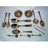 A hallmarked silver pair of salts; a pair of preserve spoons; silver sugar tongs; a silver